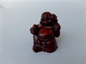 Bild von Buddha rot medetierent auf einem Sack sitzend